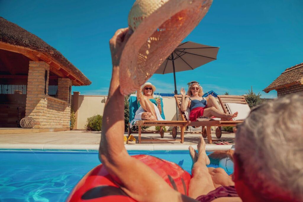 seniors in pool at senior living apartments with pool