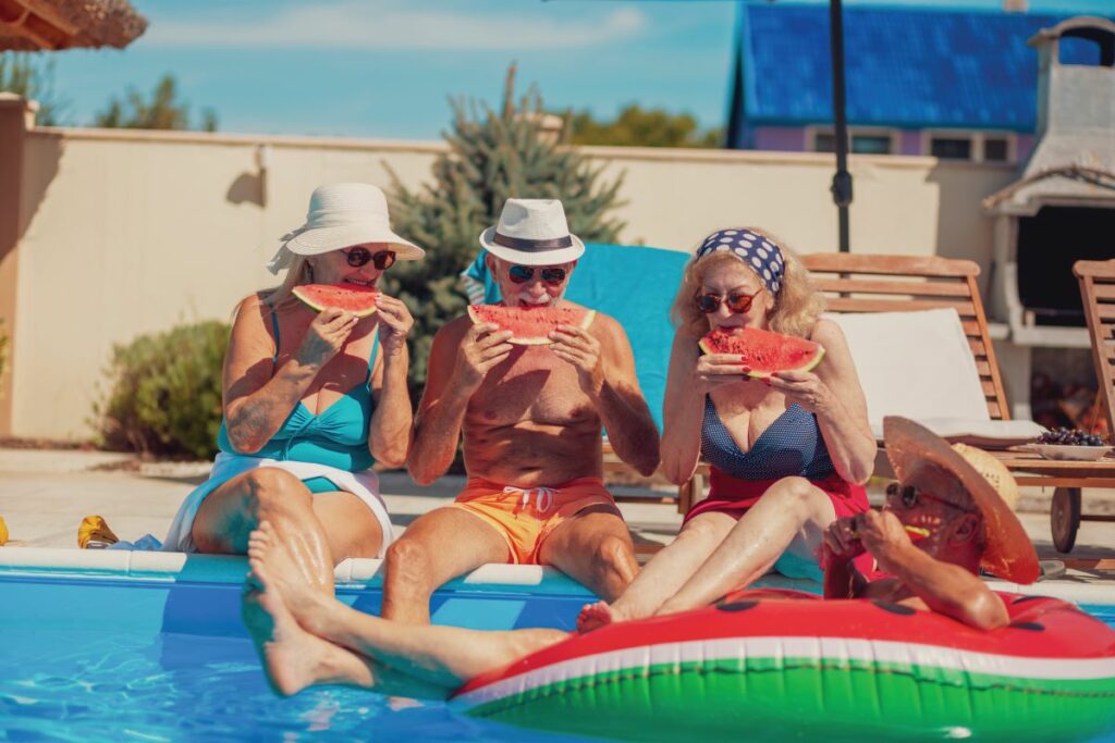 Bartlett Reserve Summer Solstice Guests enjoy watermelon by the pool